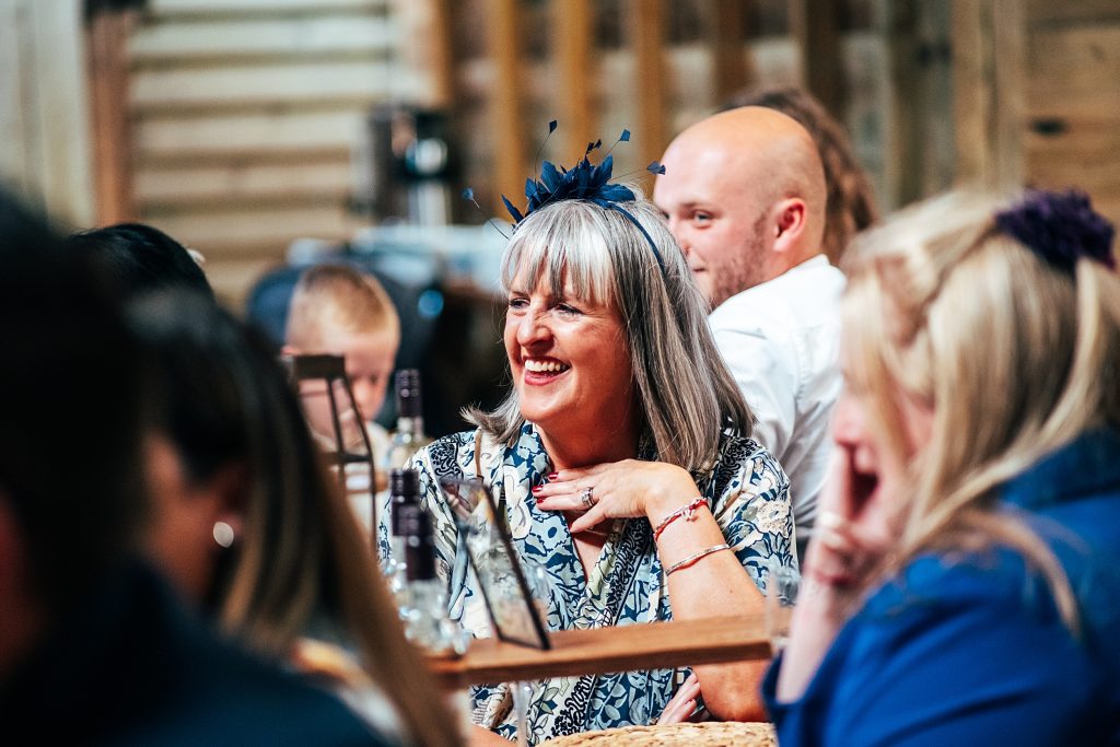 wedding guest laughs at speeches