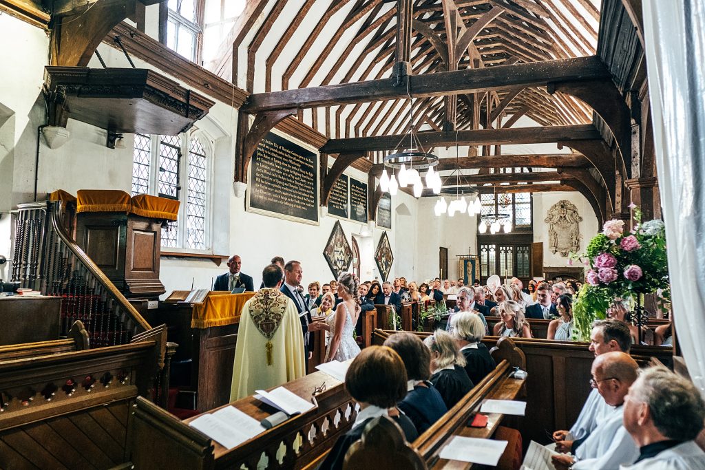 wide shot of wedding ceremony in church