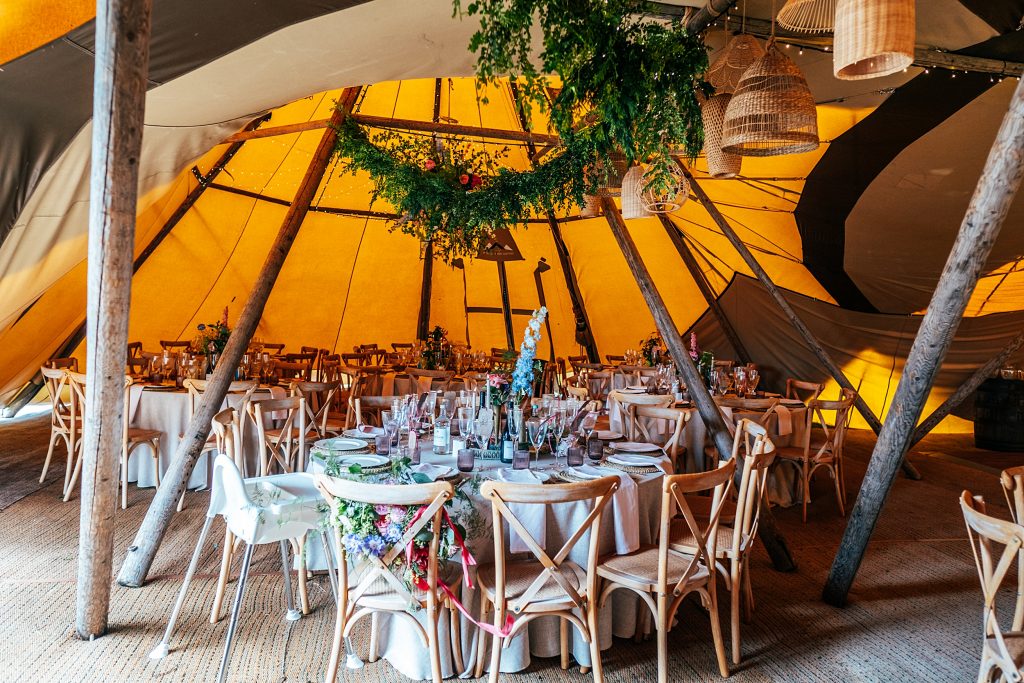 inside of tipi decorated for wedding breakfast