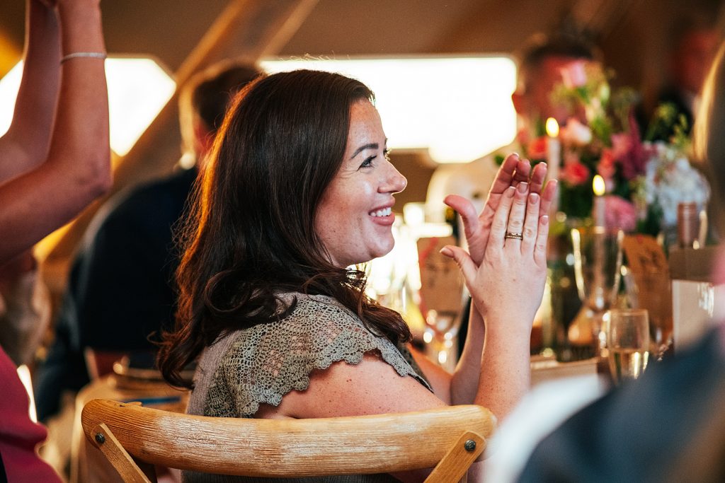 guest claps for speech in tipi