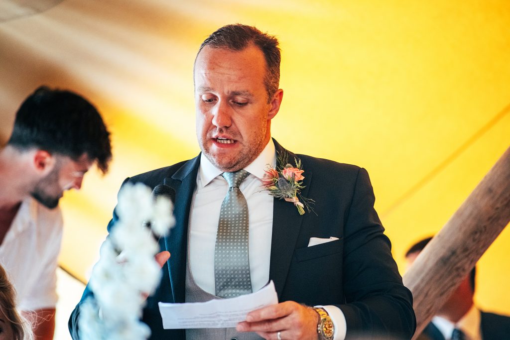 groom gives speech in tipi