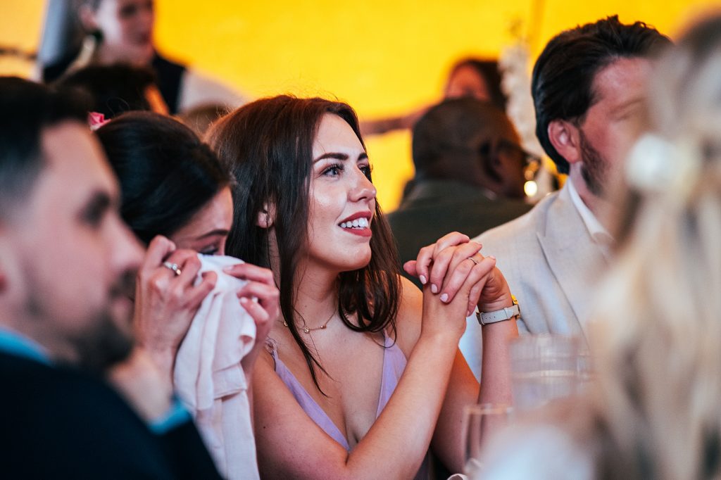 guest smiles at speeches