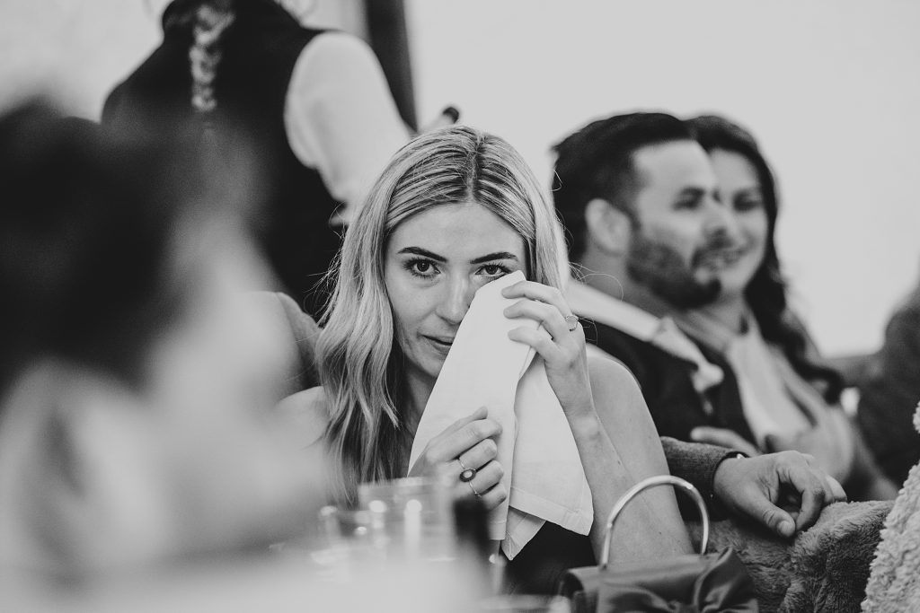 guest wipes tears away during speeches