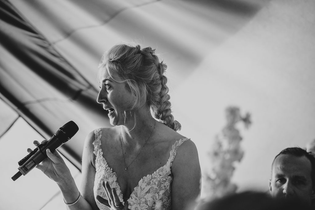 bride gives a speech in a tipi