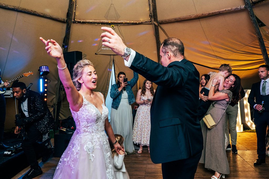 bride and groom on dance floor in tipi