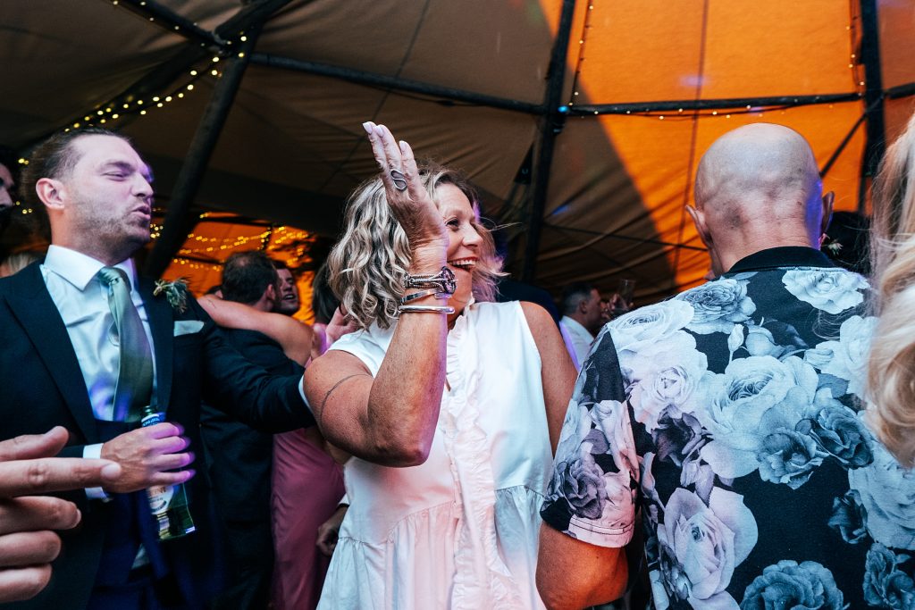 wedding guests on dance floor in tipi