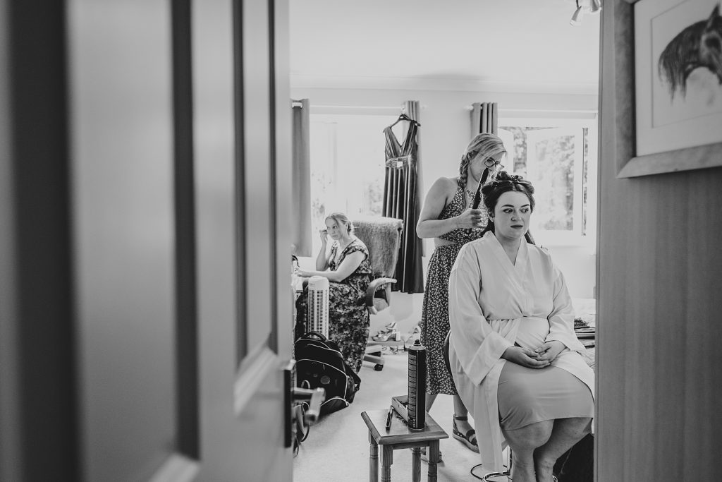 bride preps for her wedding at home