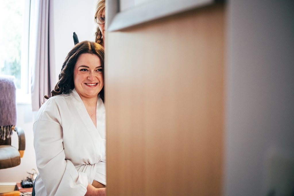 bride gets ready for wedding at family home