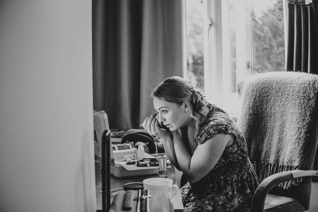 guest gets ready for wedding at home