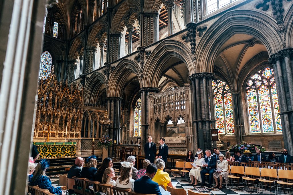 Groom waits for bride in Ely Cathedral
