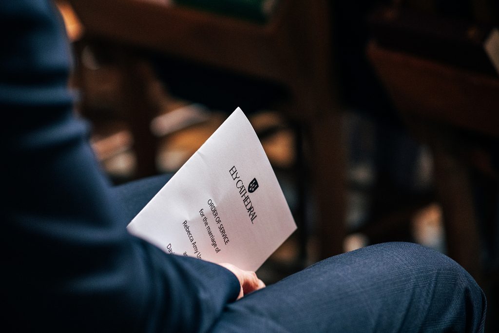 guest holds order of service