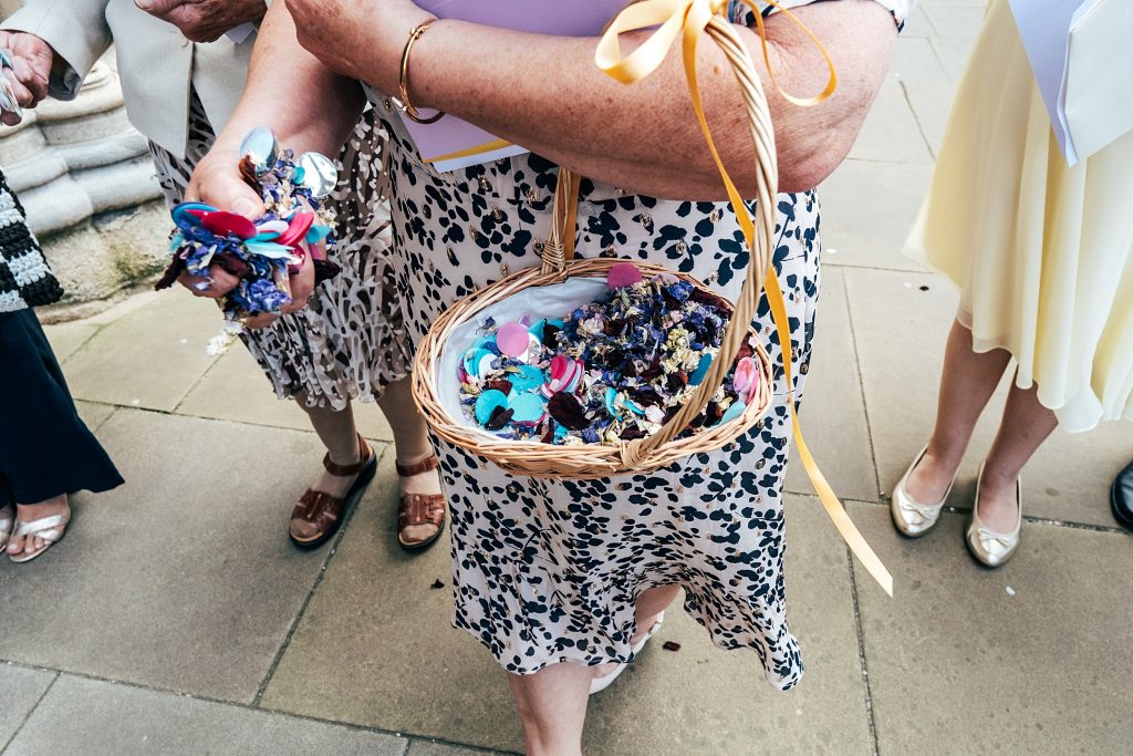 guest holds confetti basket