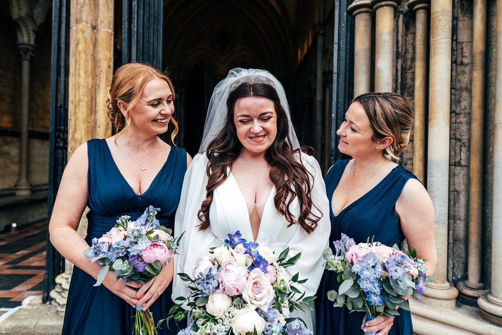 bride and bridesmaids in navy