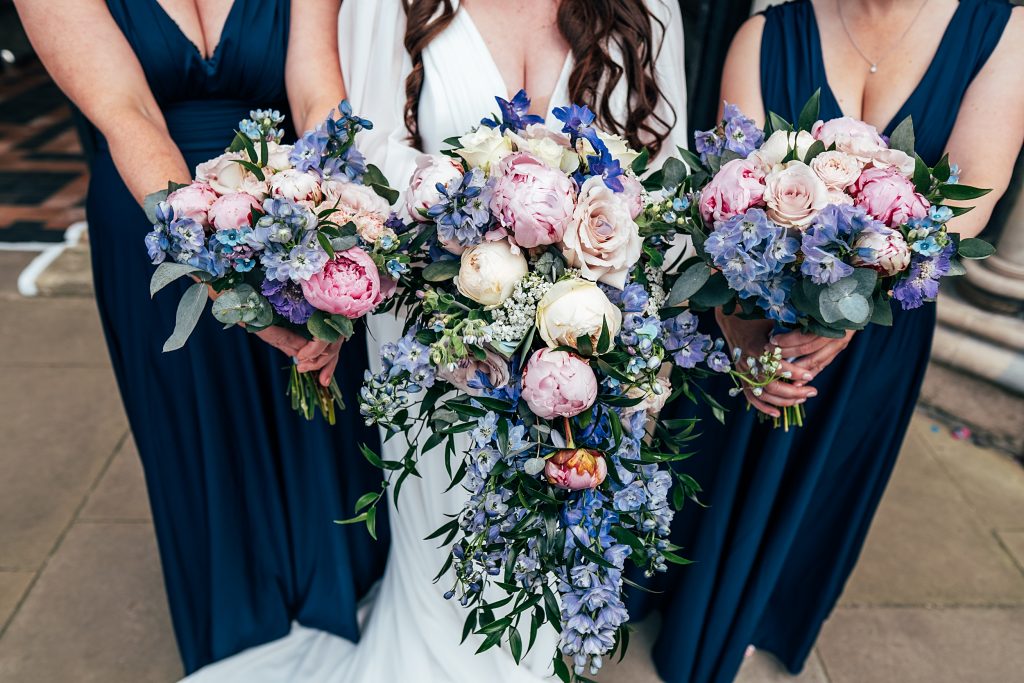 bride and bridesmaids hold bouquets