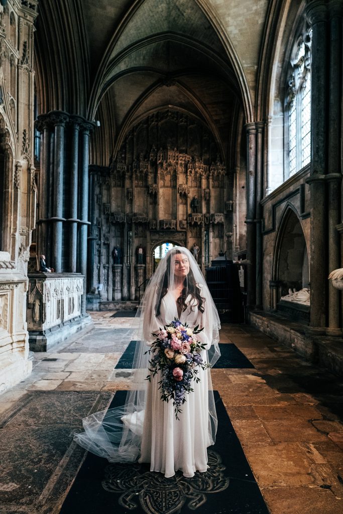 bride under veil in Ely Cathedral