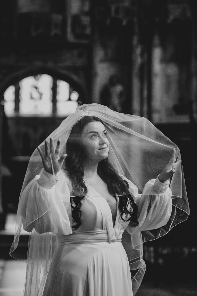 bride under veil in Ely Cathedral