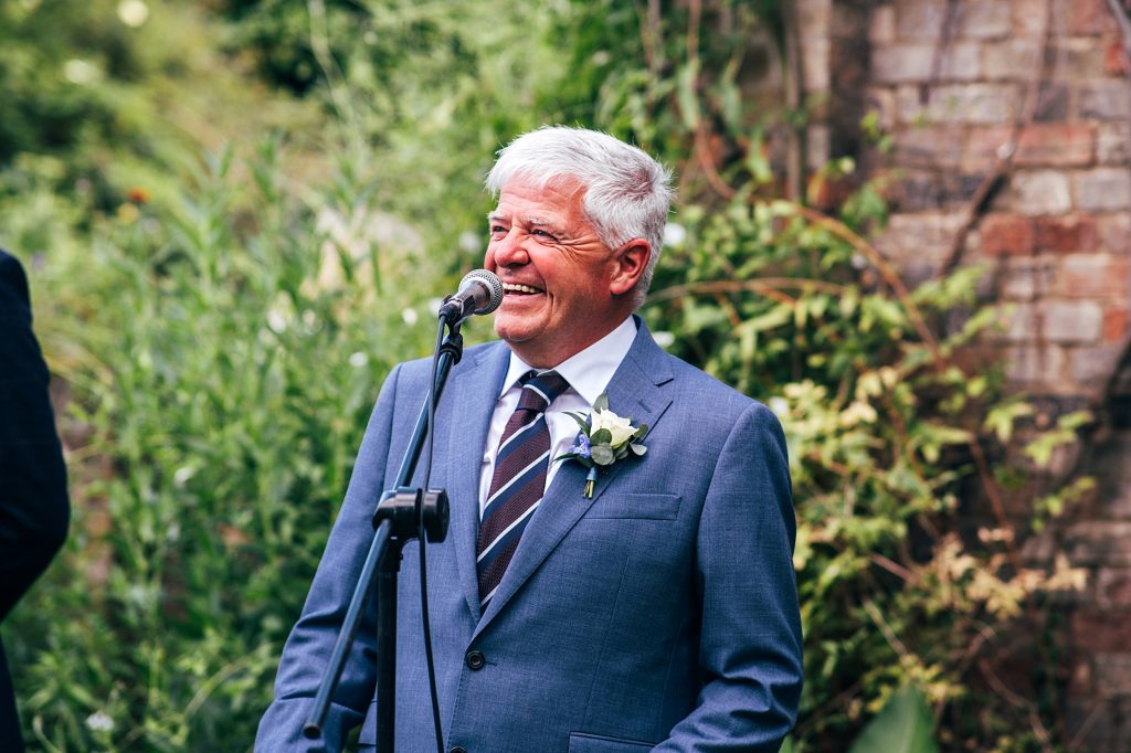 laughing father of bide during speeches