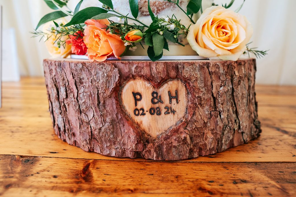 cake base with initials of couple and date
