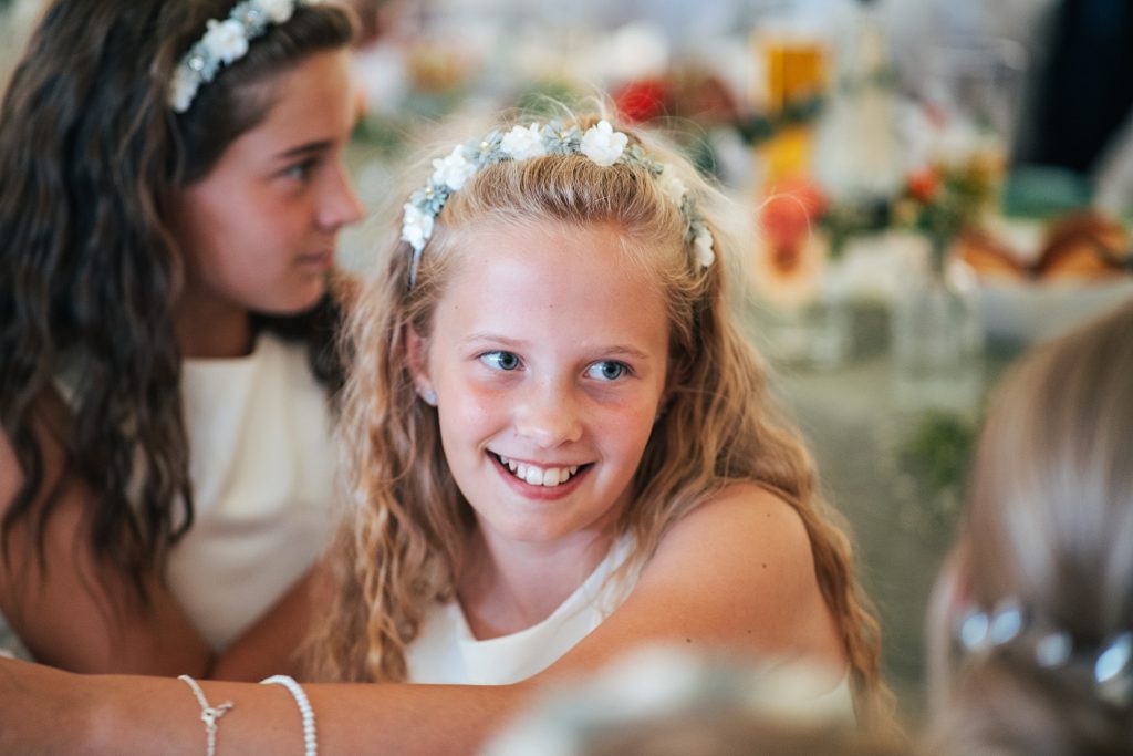 flower girl laughs during speeches