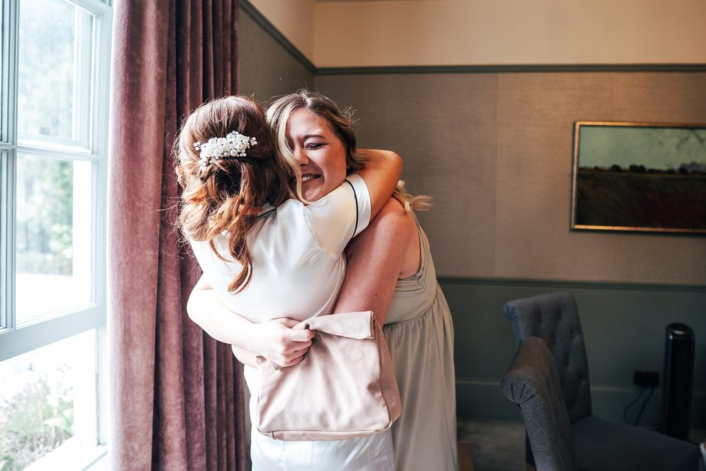 bride hugs friend