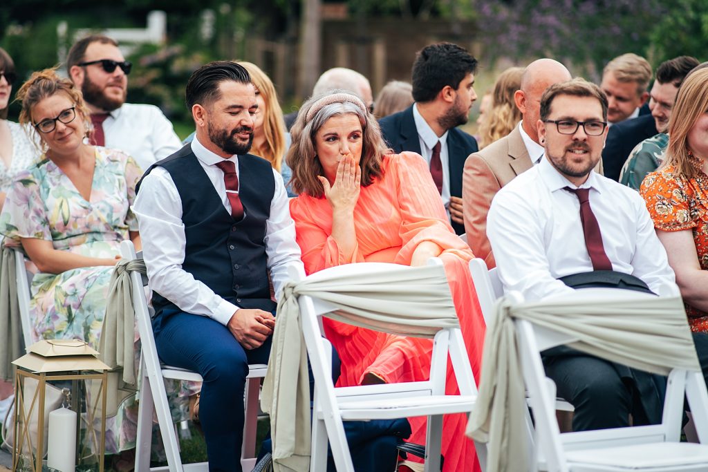 wedding guest blows kiss