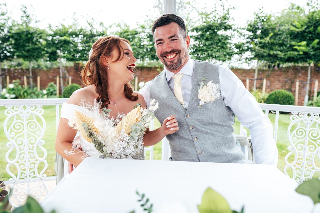 laughing bride and groom