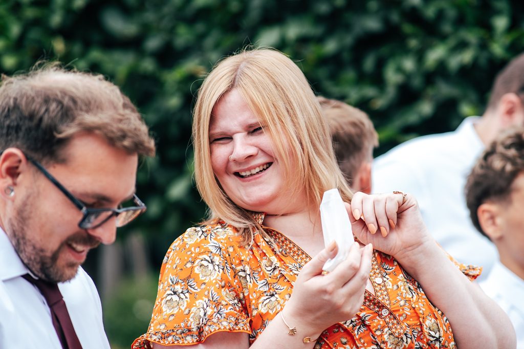 laughing guest holds confetti