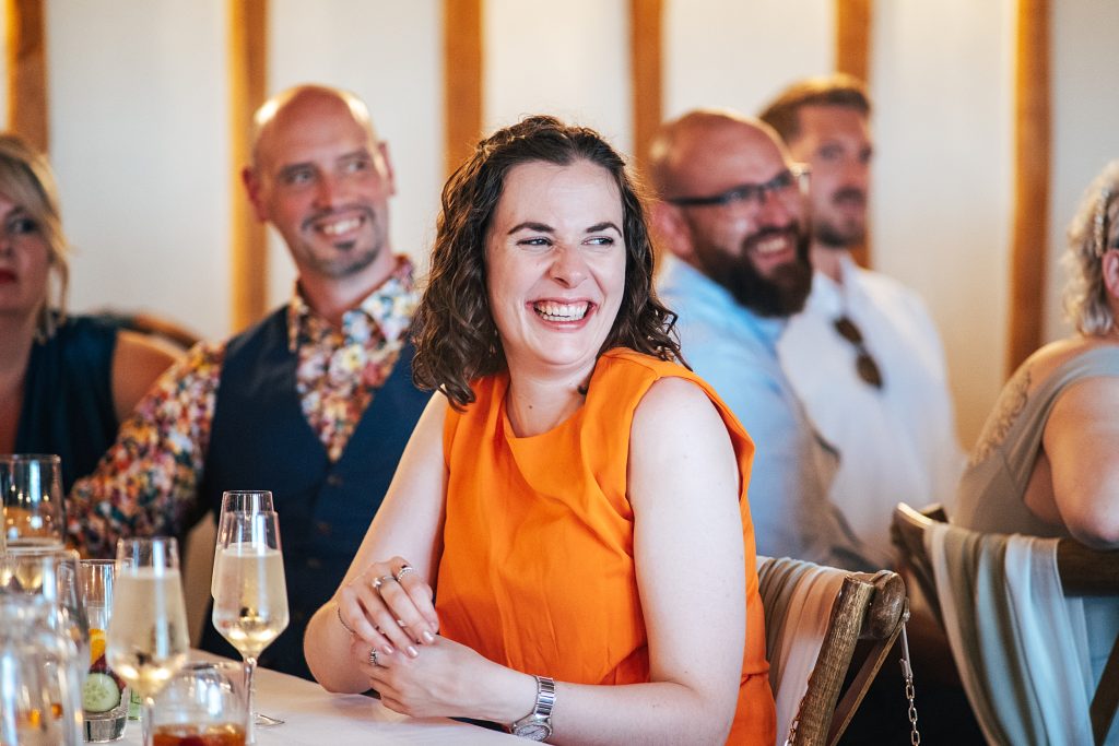 guest laughs during speech