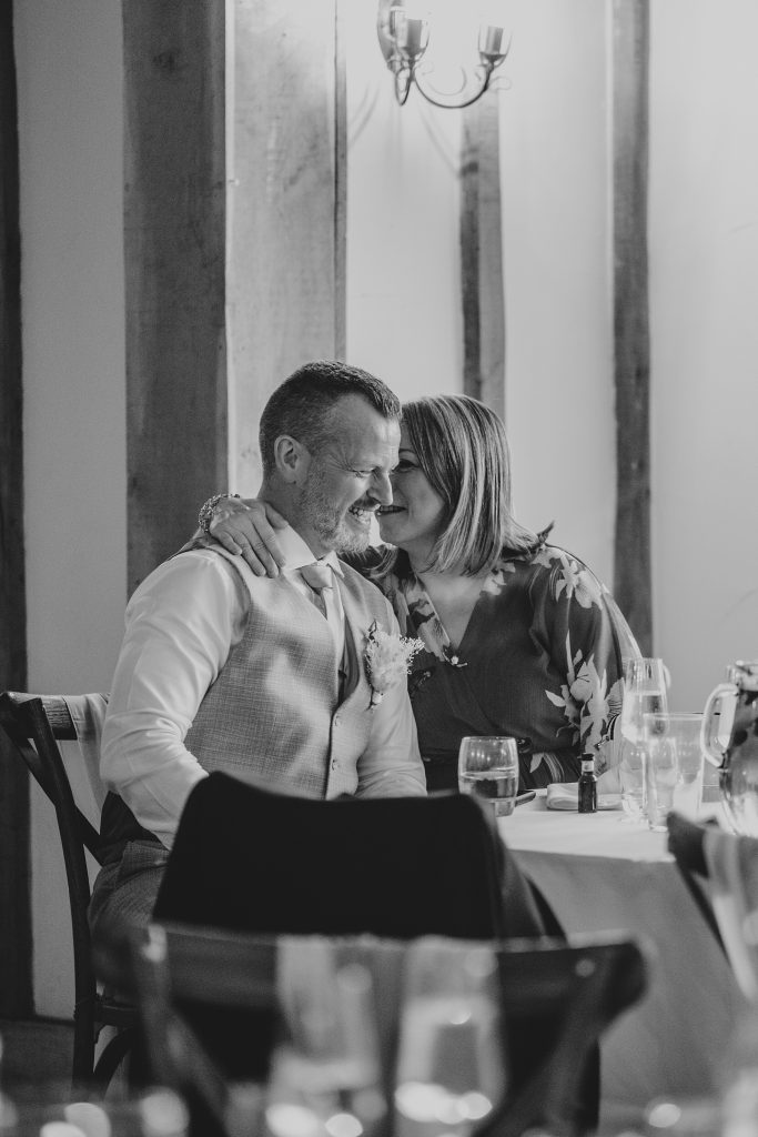 guests whisper during speech