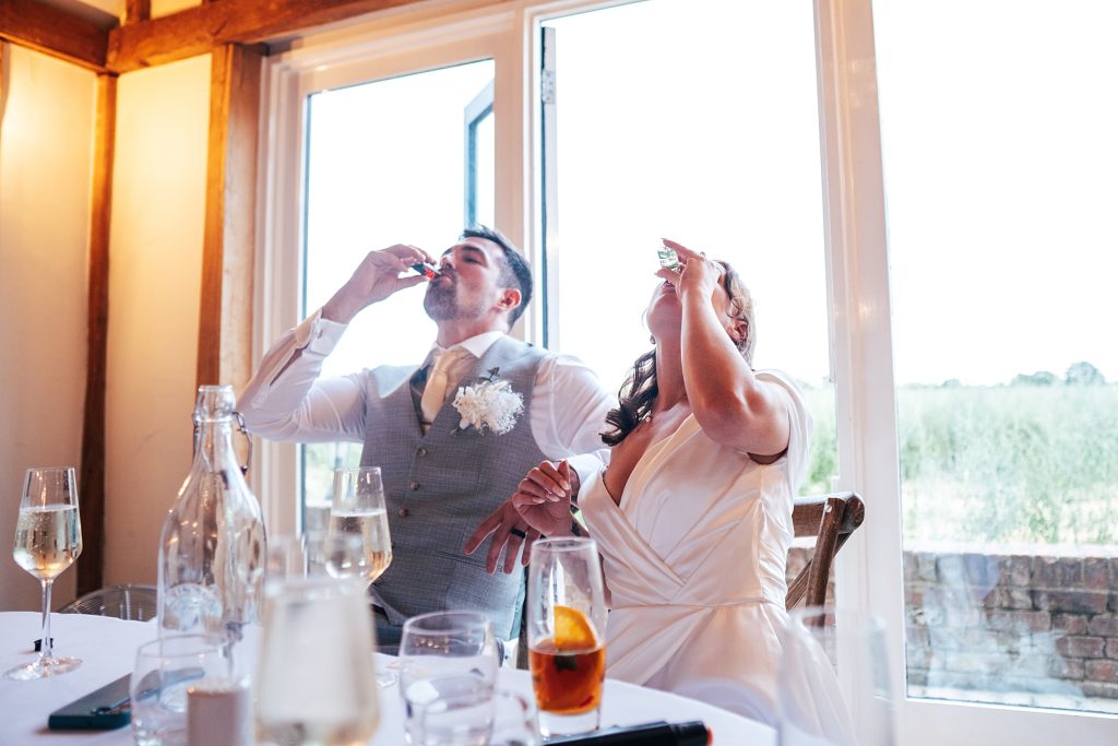 bride groom take shots