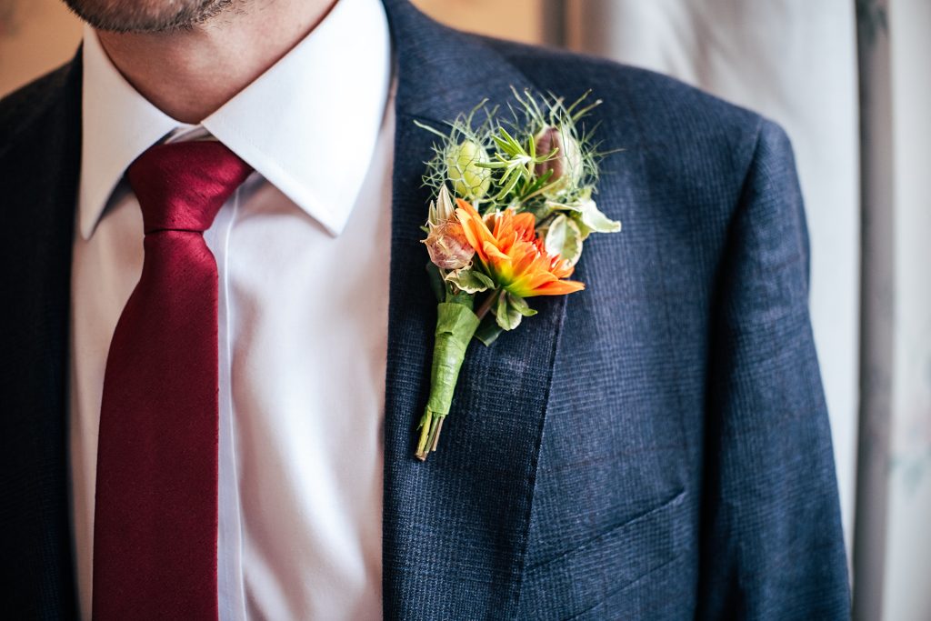detail of groom's button hole