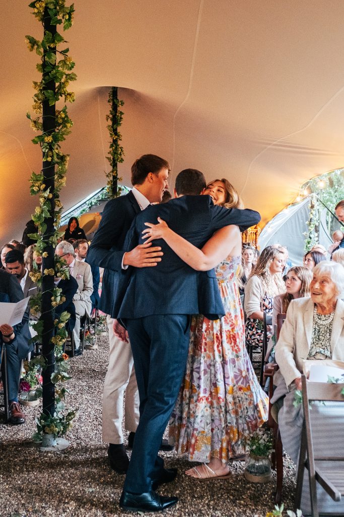 guest hugs groom