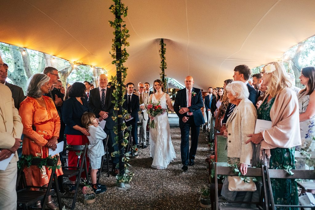 entrance of the bride in stretch canopy ceremony