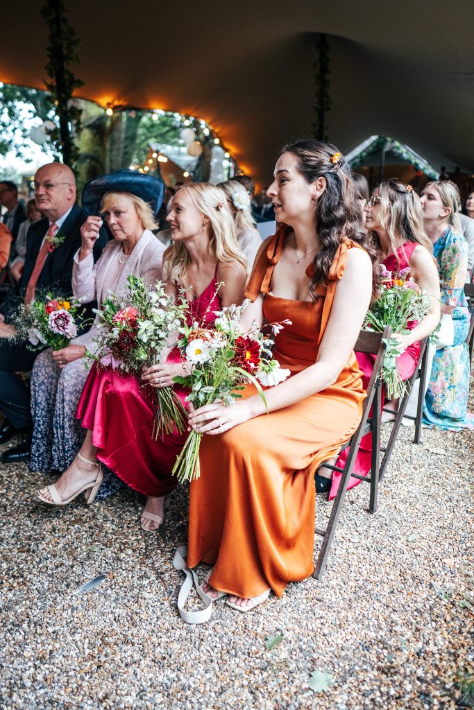 guests wipe tears and smile during ceremony