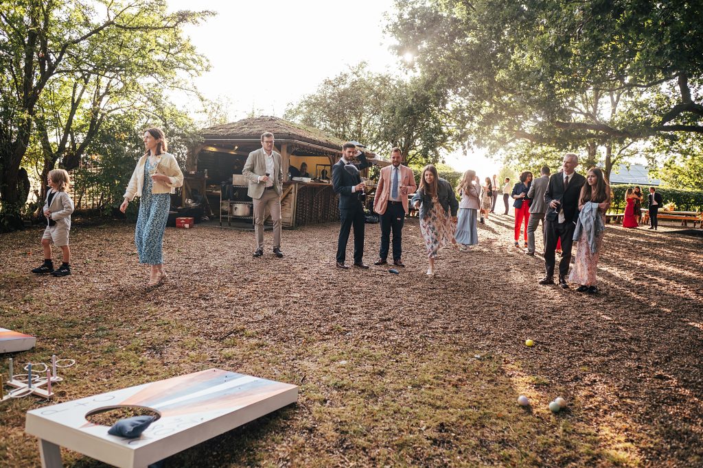 wedding guests play lawn game
