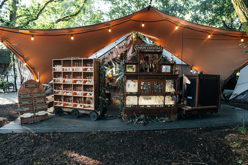 cocktail bar at wedding under stretch canopy