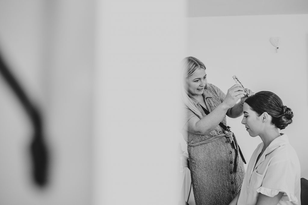 bride has tiara placed
