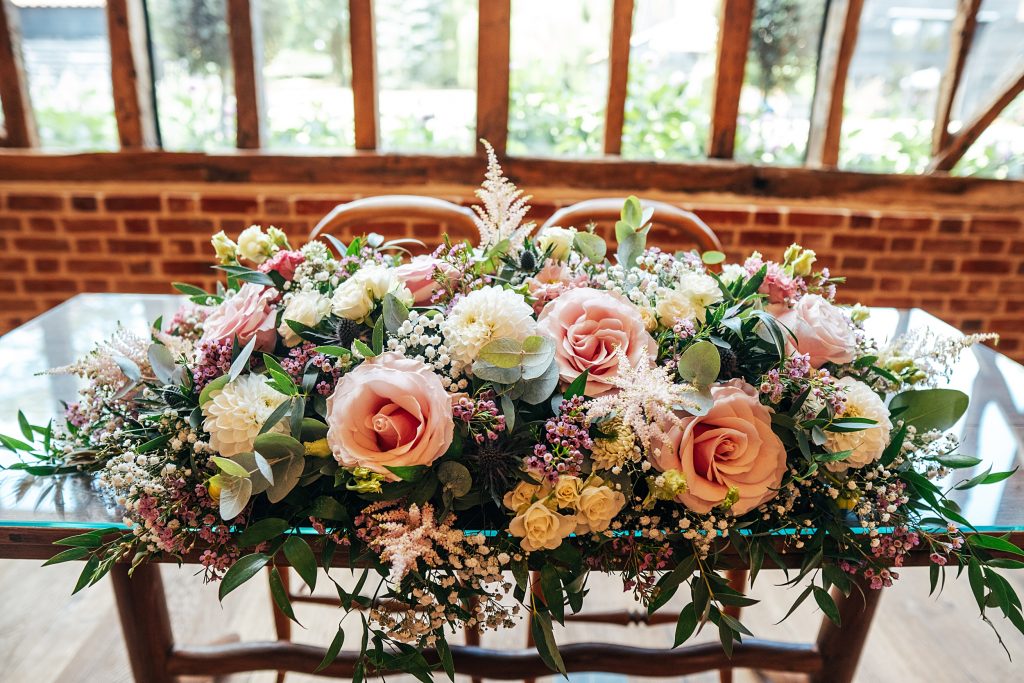 pink white floral display in ceremony
