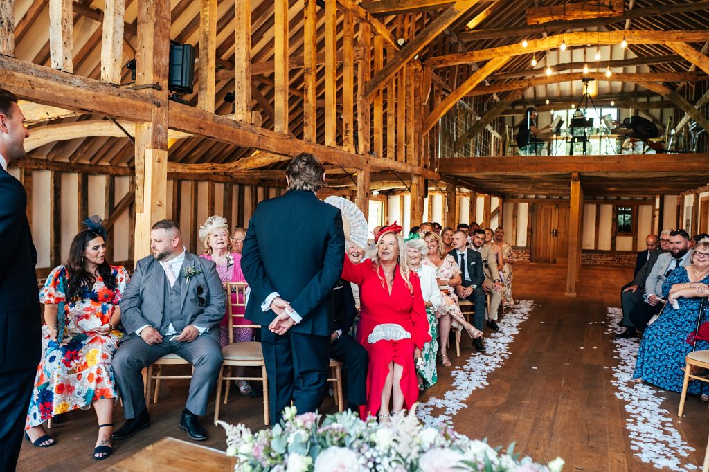 mum fans groom as he waits for bride