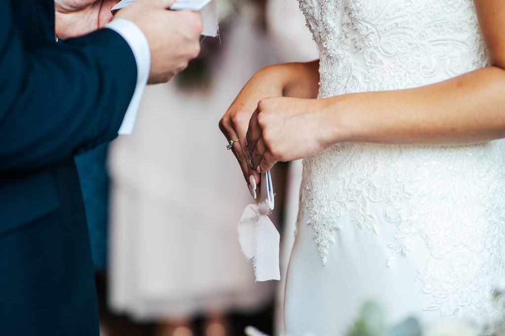 close up of bride holding vows