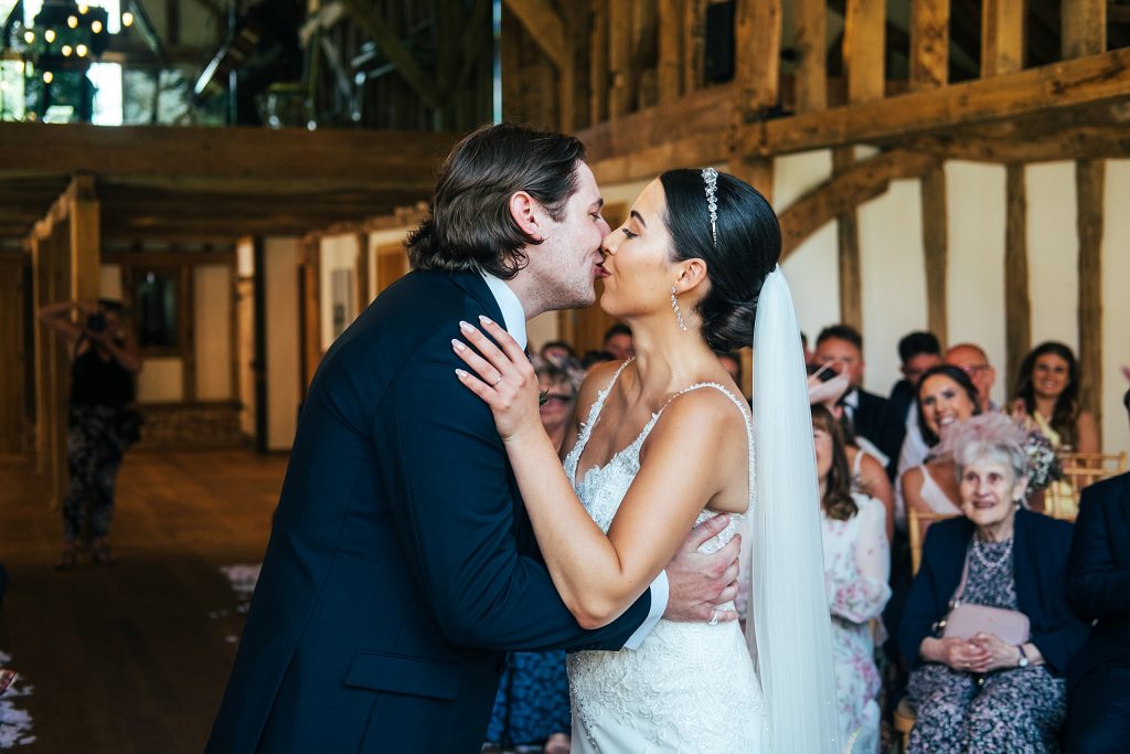 bride and groom kiss