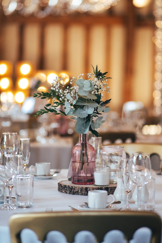 flowers on table in pink vase