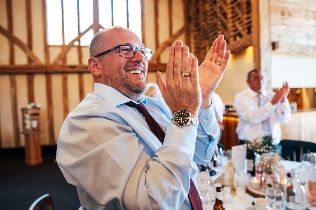 guest claps wedding entrance