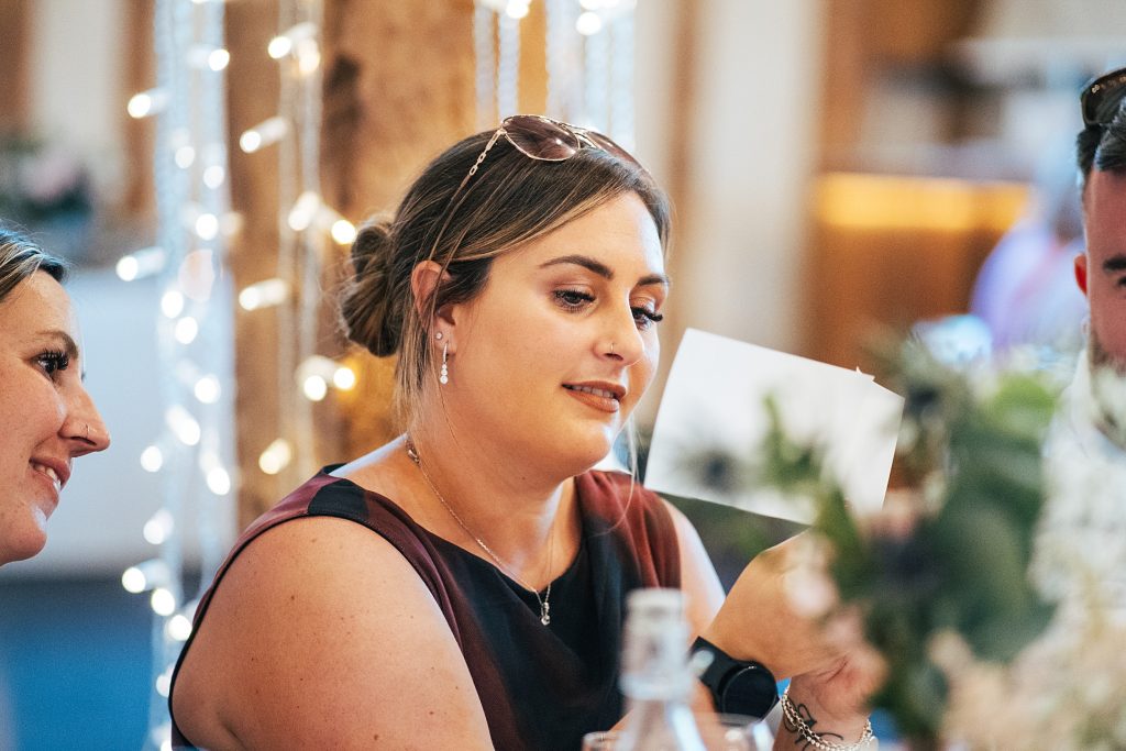 guest looks at photo during speeches