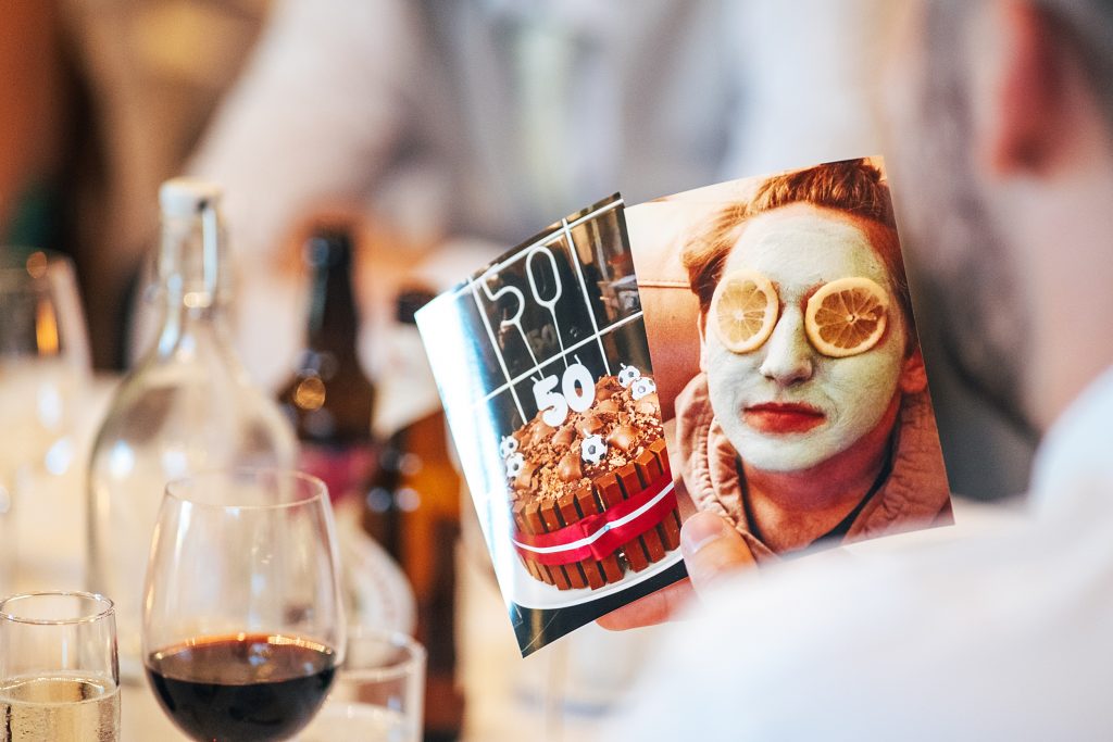 close up of photo of groom with facemask and lemons on his face