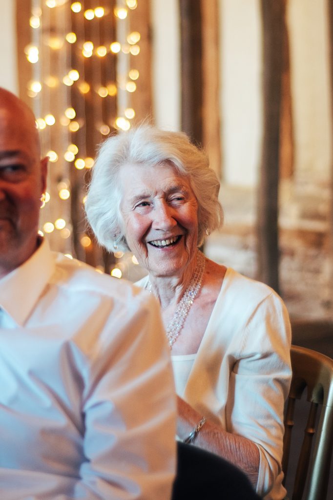 older lady laughs at speeches