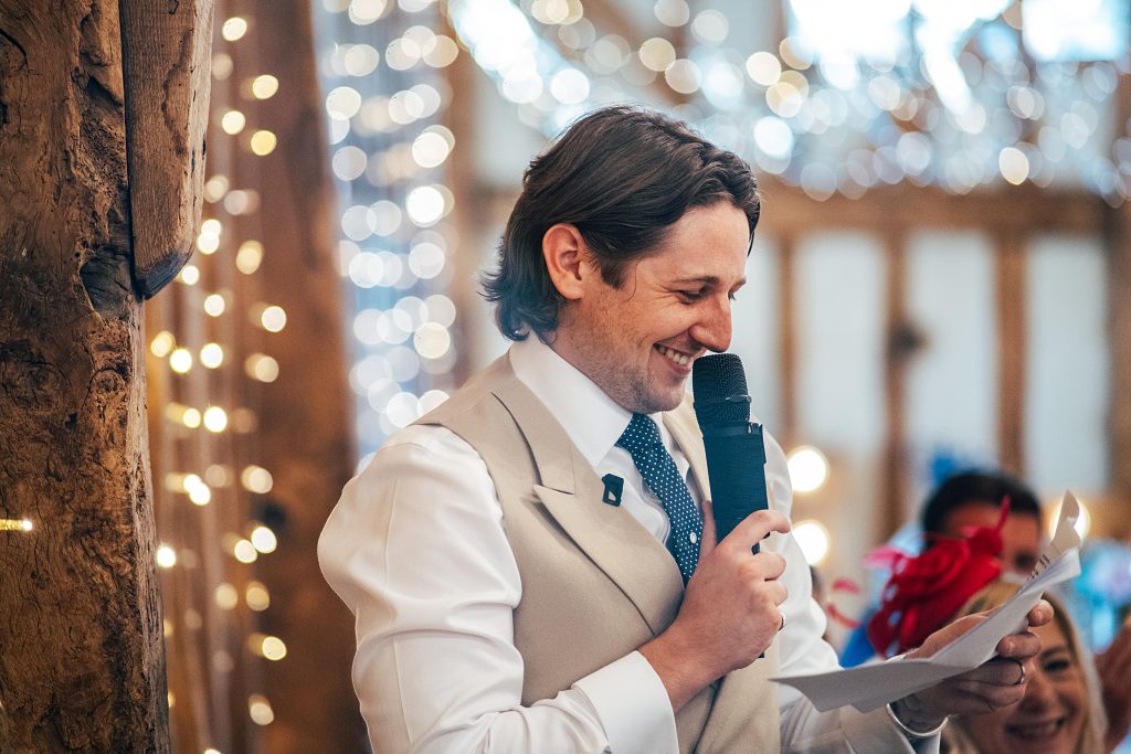 laughing groom gives speech