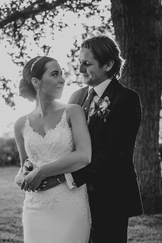 bride and groom at sunset