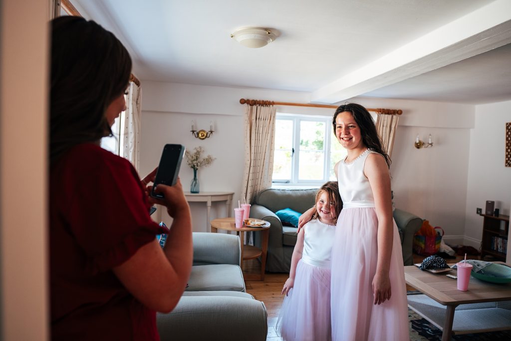 flower girls have photo taken in lounge