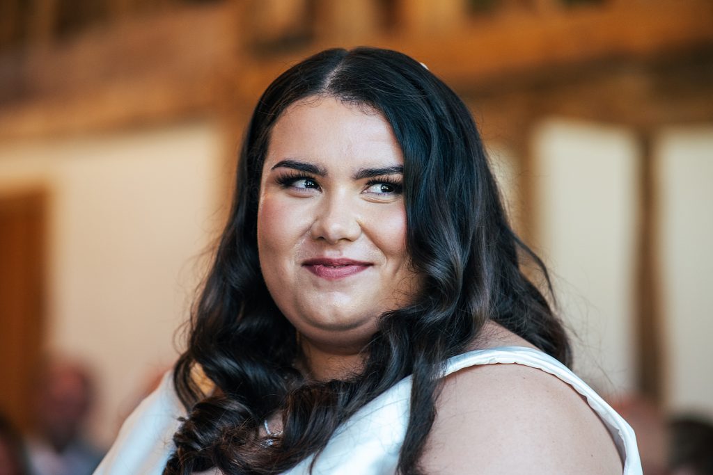 smiling bride during wedding ceremony
